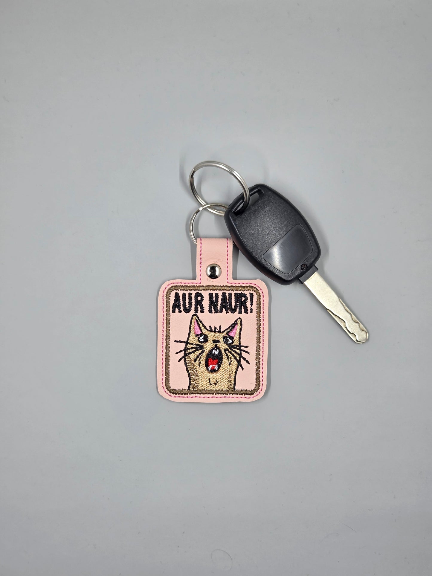 “Aur Naur!” Embroidered Cat Keychain | Funny Vinyl Cat Lover Keychain