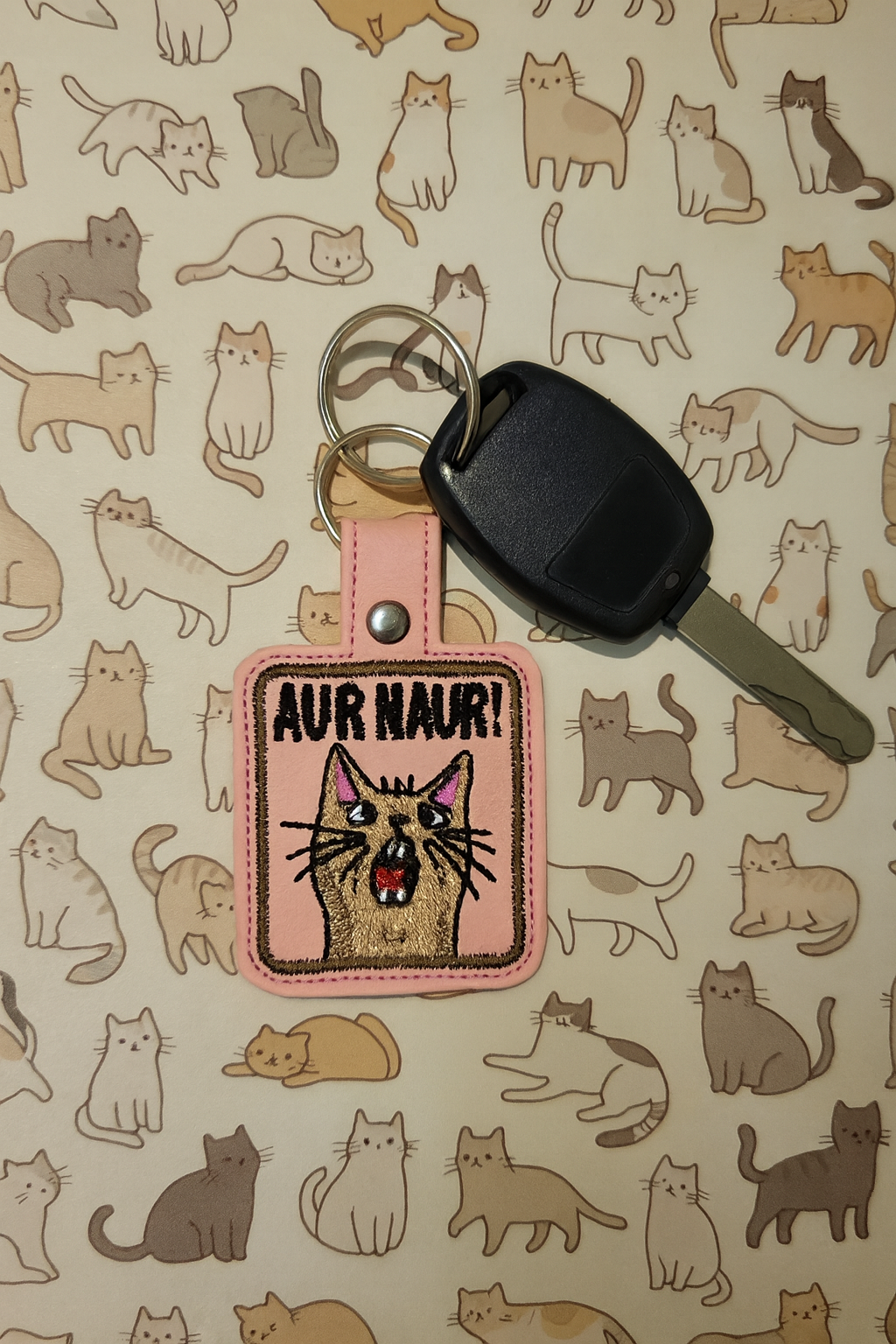 “Aur Naur!” Embroidered Cat Keychain | Funny Vinyl Cat Lover Keychain