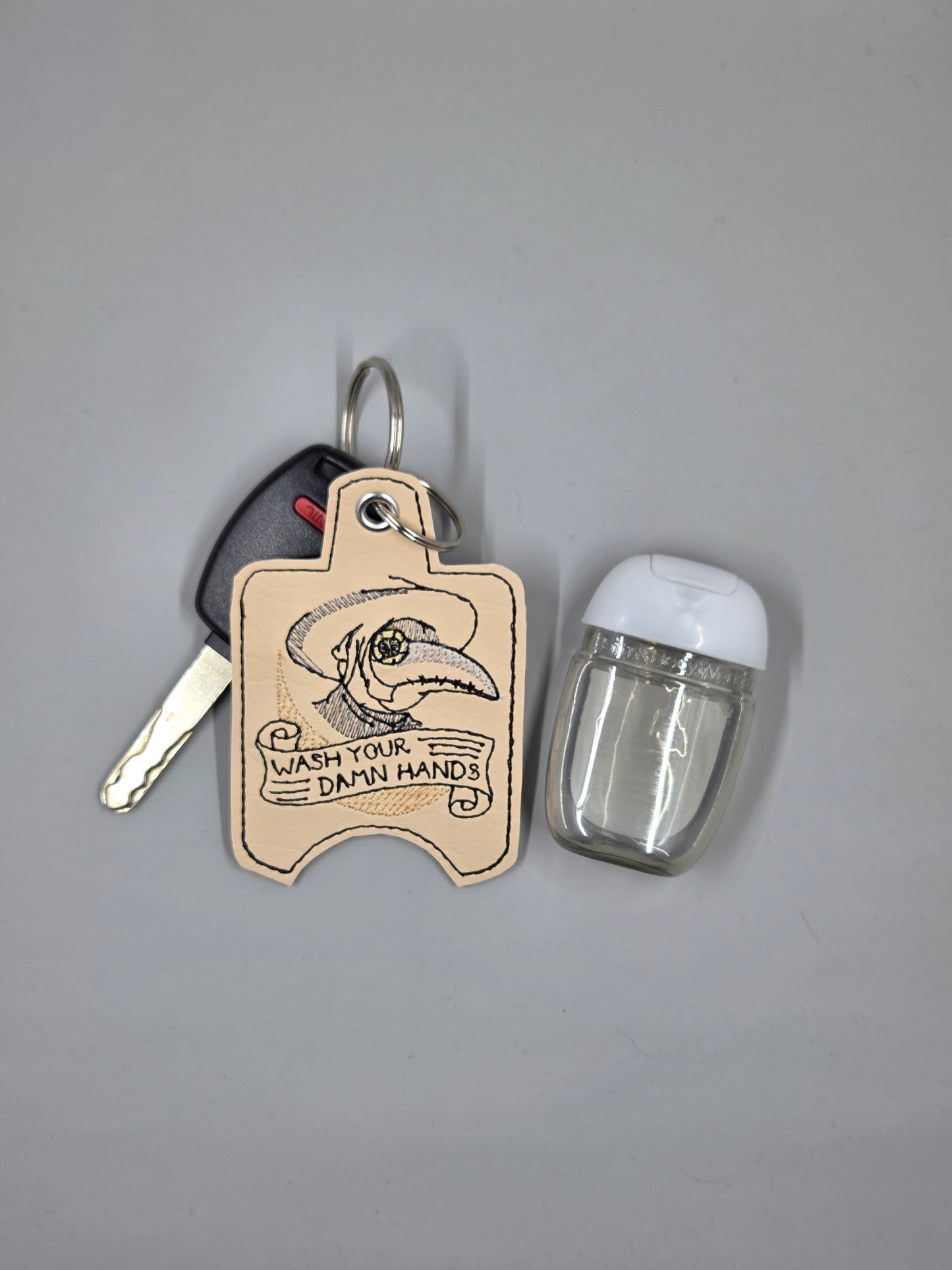 Plague Doctor “Wash Your Damn Hands” Embroidered Hand Sanitizer Holder | Vinyl Keychain